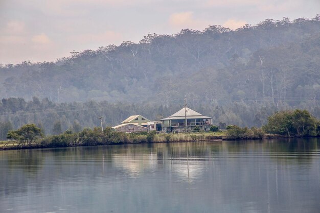 Built structure by lake against sky