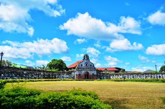 Built structure on field against sky