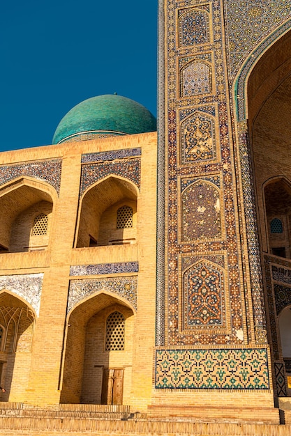 Bukhara Uzbekistan View of the entrance of Kalon madrasah during the sunset