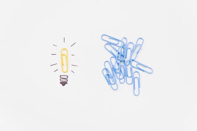 Photo bulb drawing with yellow paperclip as light high quality and resolution beautiful photo concept