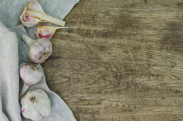 Bulbs of garlic on a rustic wooden 