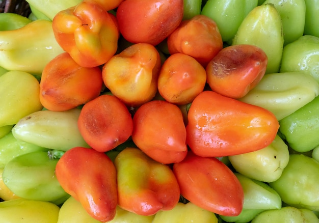 Bulgarian pepper is green and red in the basket