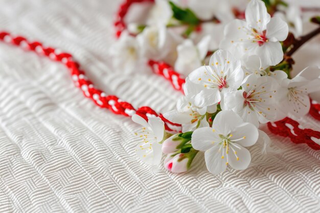 Bulgarian spring tradition with martenitsa and flowers