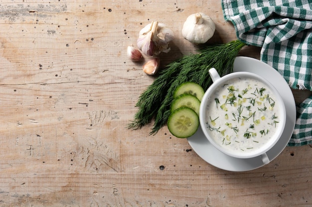 Bulgarian tarator sour milk soup on wooden table