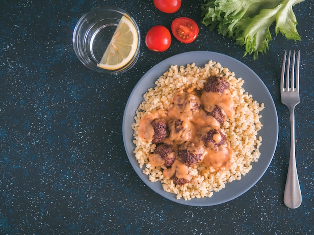 Bulgur and meatball in plate