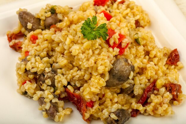 Bulgur with chicken hearts