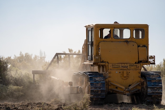 bulldozer clearing soil to make residential neighborhood