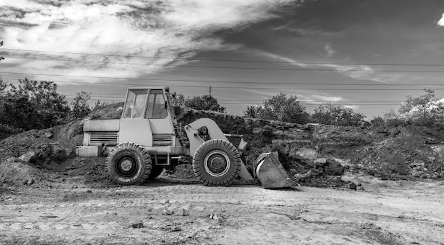 A bulldozer or loader moves the earth during the construction Heavy equipment for earthworks