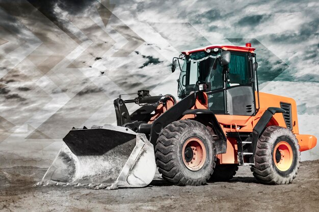 Bulldozer or loader moves the earth at the construction site against the blue sky An earthmoving machine is leveling the site Construction heavy equipment for earthworks