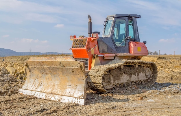 bulldozer on loamy ground