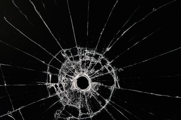 bullet hole on glass black background for overlay, transparent window