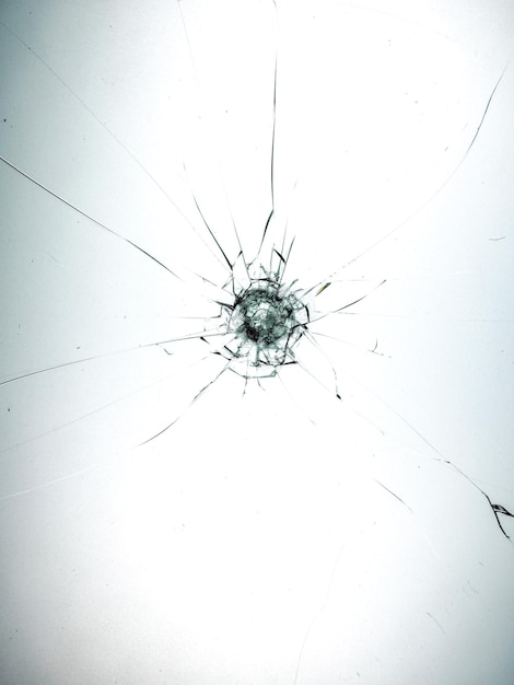 Bullet Hole in glass isolated on white background