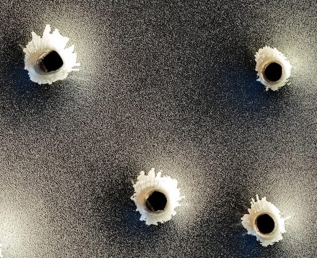 Bullet holes in metal. Concept, use of firearms.