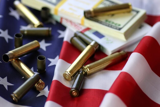 Bullet and money on the american flag