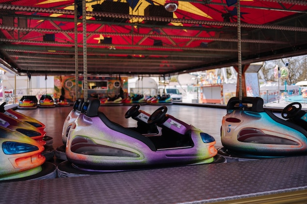 Bumper car at fun fair colorful electric cars in amusement park