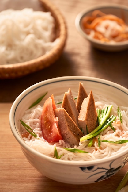 Bun cha ca - one of most popular soup noodle in the seaside area with rice noodle, grilled fish, green onion, tomato and fish sauce...