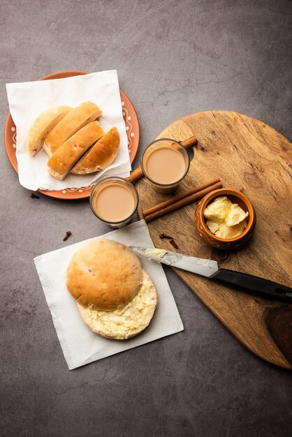 Bun-maska Tea or bun Maska chai combo features a slightly sweet bun studded with raisins that is cut into half and laden with wholesome butter, Mumbai food