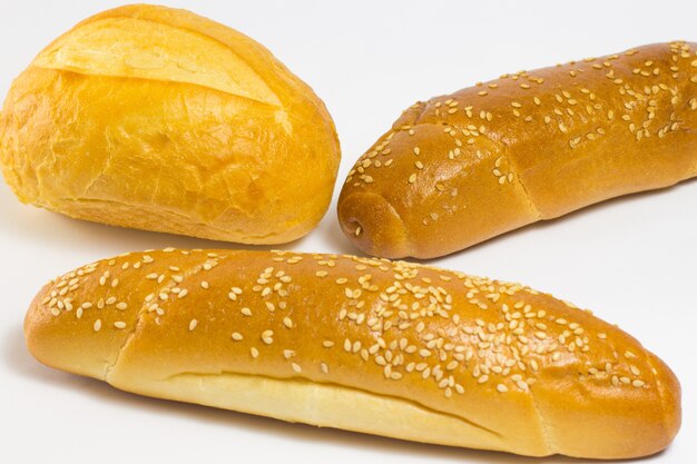 Bun and two baguette with sesame seeds and sunflower seeds