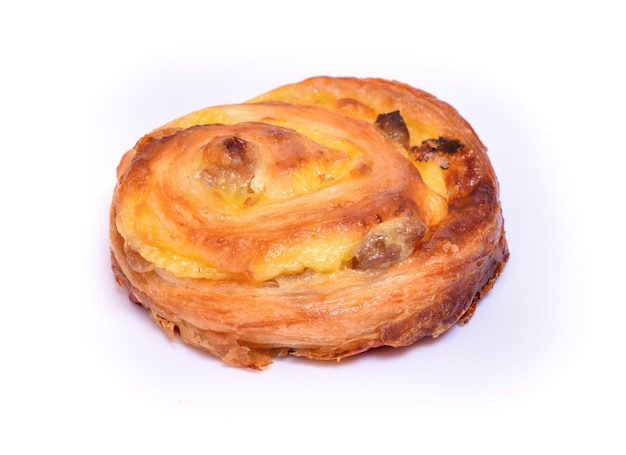 Bun with raisins on a white background.