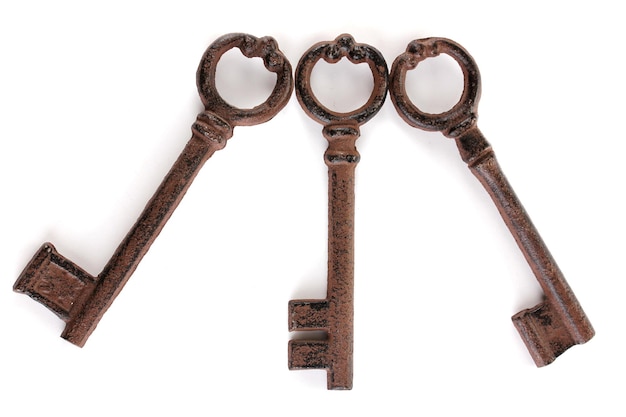 A bunch of antique keys isolated on white