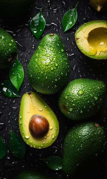 A bunch of avocados with water drops on a black background