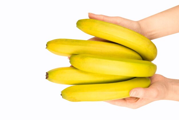 A bunch of bananas in woman hand isolated on a white background