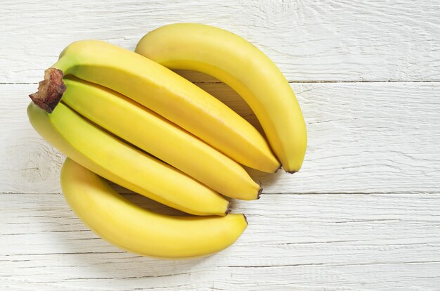 Bunch of bananas on a wooden table