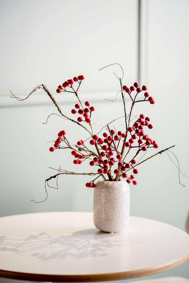 Bunch of berries on the table in a vase