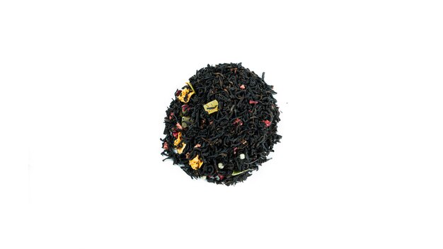 Bunch of black tea leaves with fruits isolated.