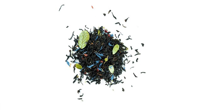 Bunch of black tea leaves with fruits isolated.