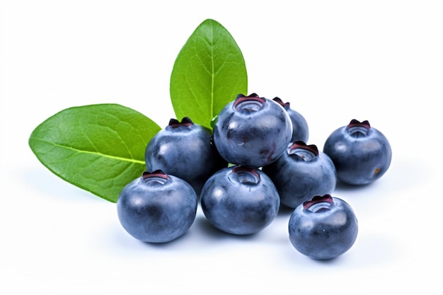 a bunch of blueberries with leaves on a white surface