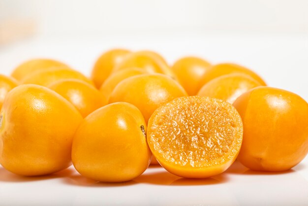 Bunch of bright yellow ripe cape goldenberries isolated on white background