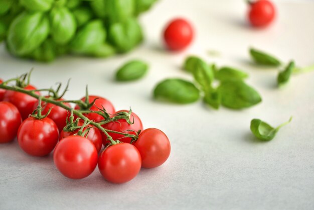 Bunch of cherry tomatoes with basil