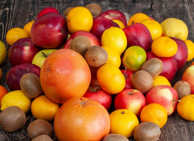 A bunch of citrus tangerines and other fruits together