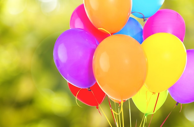 Bunch of colorful balloons on background