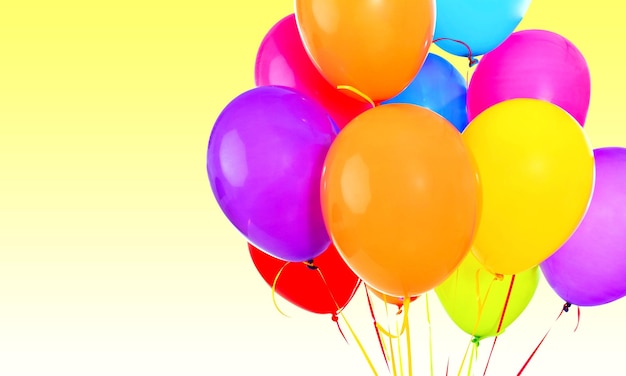 Bunch of colorful balloons on blurred background