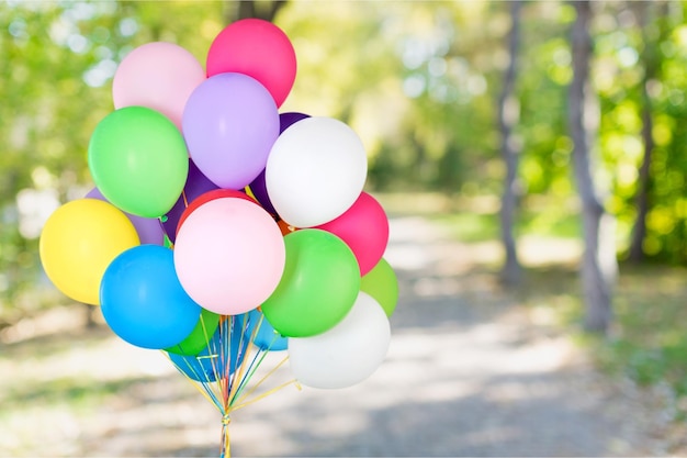 Bunch of colorful balloons on blurred background