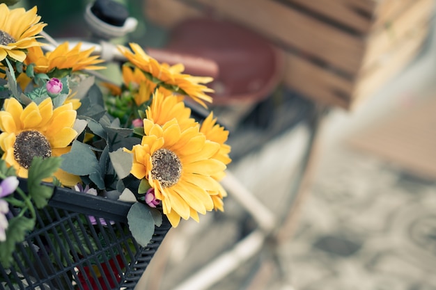 Bunch of colorful flowers in the bicycle basket