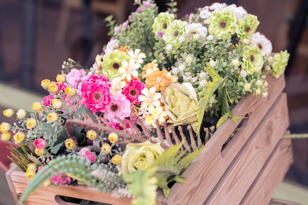 Bunch of Colorful Flowers in the wooden Basket