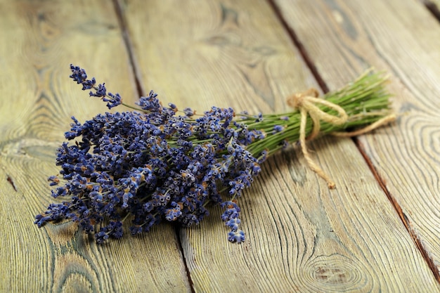 Bunch of dried lavender on wooden background