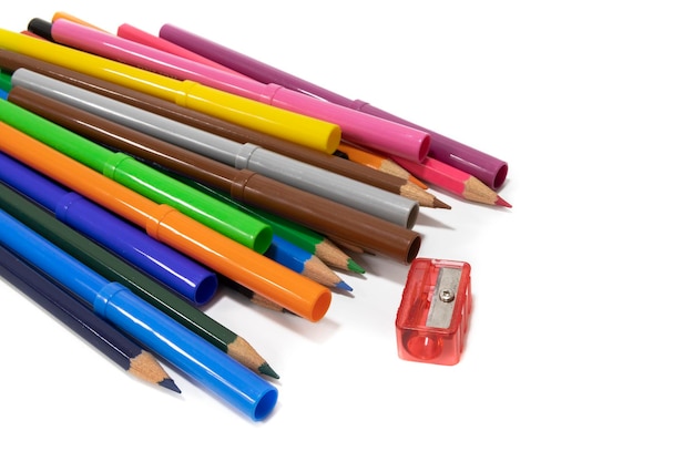 A bunch of felttip pens and colored pencils isolated on a white background Back to school concept