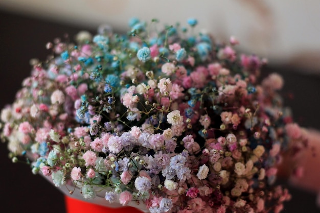 A bunch of flowers in a red bucket