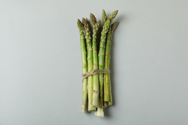 Bunch of fresh asparagus on light gray