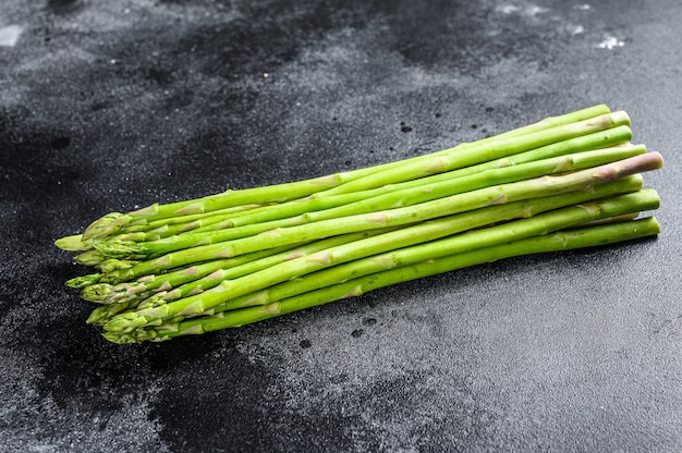 Bunch of fresh asparagus on wrought table