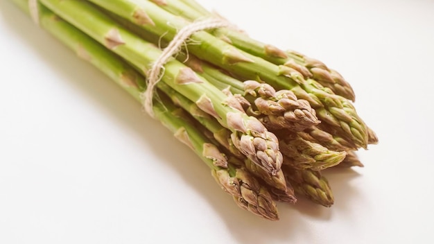 A bunch of fresh green asparagus harvested on an organic family farm