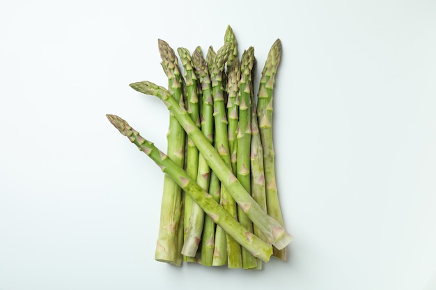 Bunch of fresh green asparagus on white