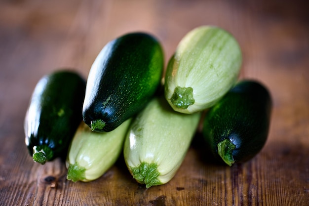 Bunch of fresh marrow squash is on farmers table