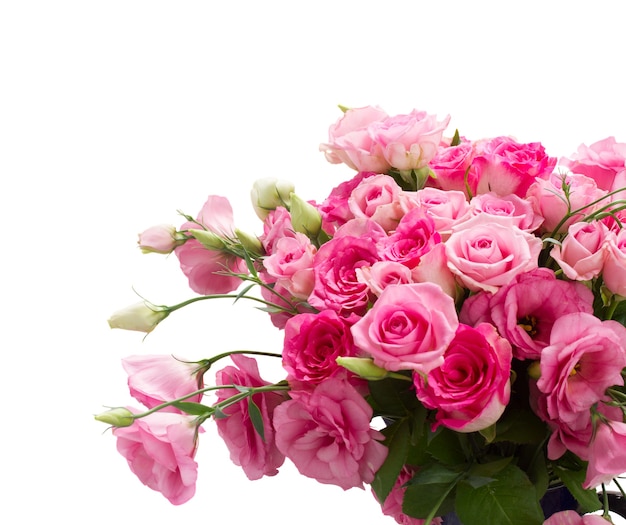 Bunch of fresh pink roses and eustoma flowers close up isolated