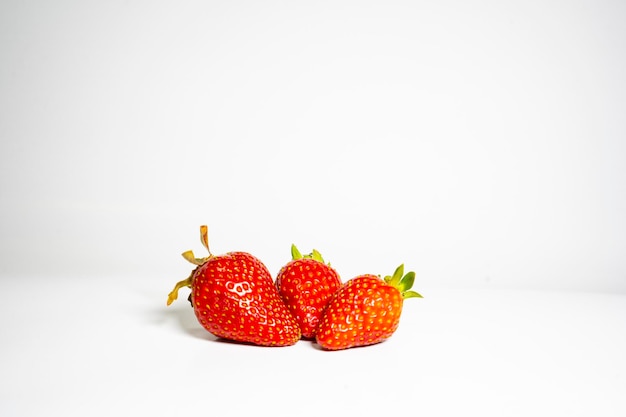 bunch of fresh strawberries isolated on white background