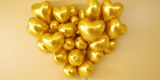 A bunch of gold balloons with the words love on them